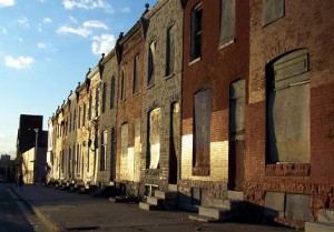 baltimore-street This blighted Baltimore street is typical housing in the neighborhoods served by the nonprofit Open Door Community Development Corporation.