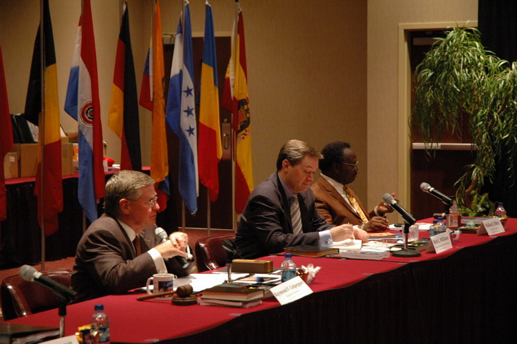 General Overseer Raymond Culpepper (left) addresses members of the International Council, while Mark Williams and Wallace Sibley look on