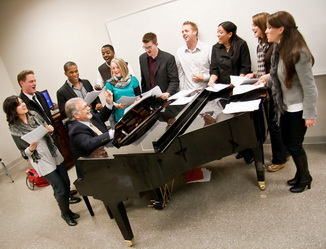 voices-sing-off Voices of Lee director Danny Murray (at keyboard) works with members of Voices who will compete on "The Sing-Off."