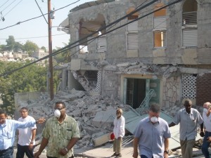 048 Raymond Culpepper (third from right) views first hand the devastation caused by the January earthquake in Haiti.