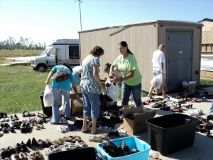 phil-campbell-6 Members of the Phil Campbell Church of God gather shoes.