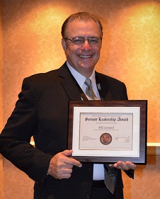 leonard-gets-award Dr. Bill Leonard displays award received from AACC