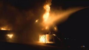 The sanctuary of the Pulaski Church of God goes up in flames on January 11, 2017.
