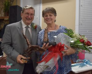 Coleman and Bonnie Peacock display gifts given to them upon their retirement (click photo to enlarge).