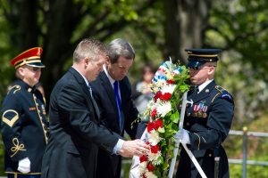 Tom Madden, center, is assisted as he lays a wreath at the Tomb of the Unknown Soldier (click photo to enlarge)