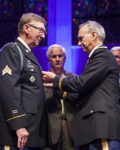 Chaplain (Colonel) Richard Pace (right) pins Pastor Gerald McGinnis with the Army Bronze Star with Valor at the recent Tennessee Camp Meeting (click photo to enlarge)