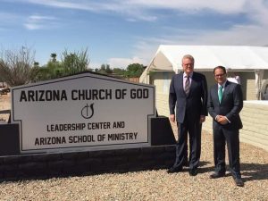 Arizona State Administrative Bishop Sean O'Neal (right) poses with General Overseer Tim Hill next to the sign at the new Arizona State Leadership Center (click photo to enlarge)